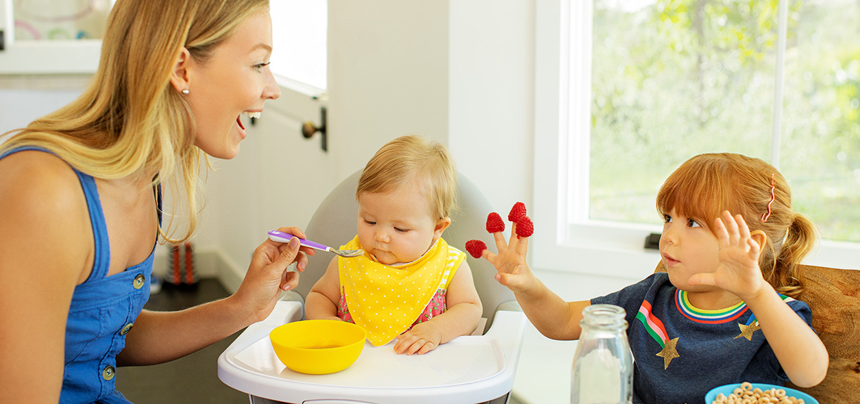 mom feeding kids
