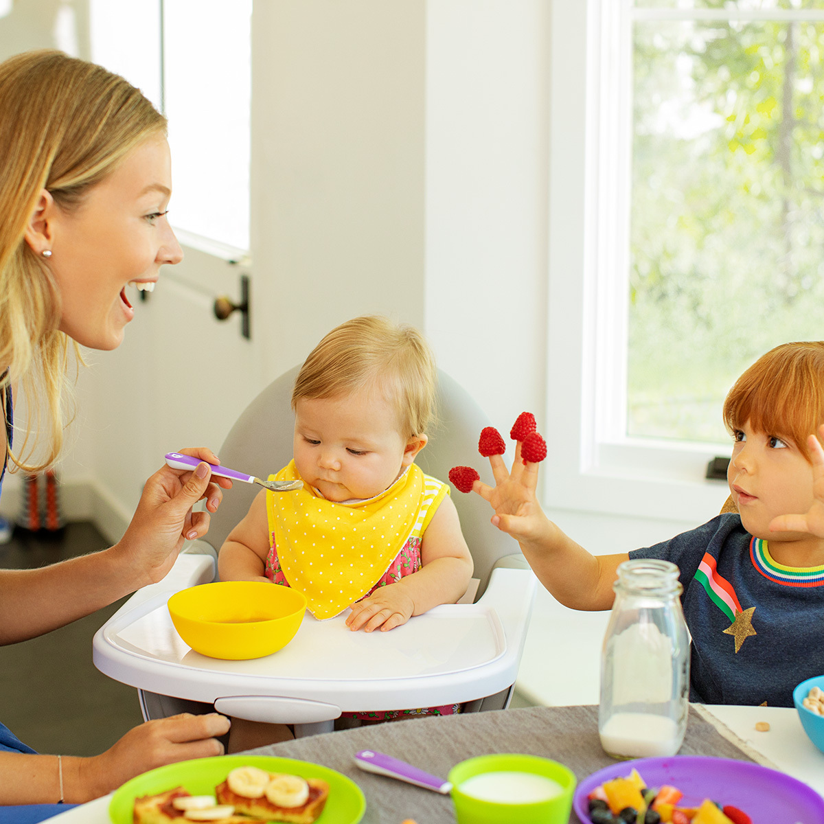 mom feeding kids