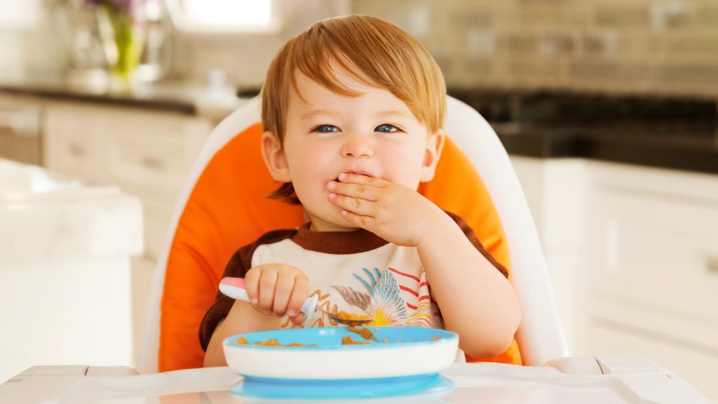 young boy eating