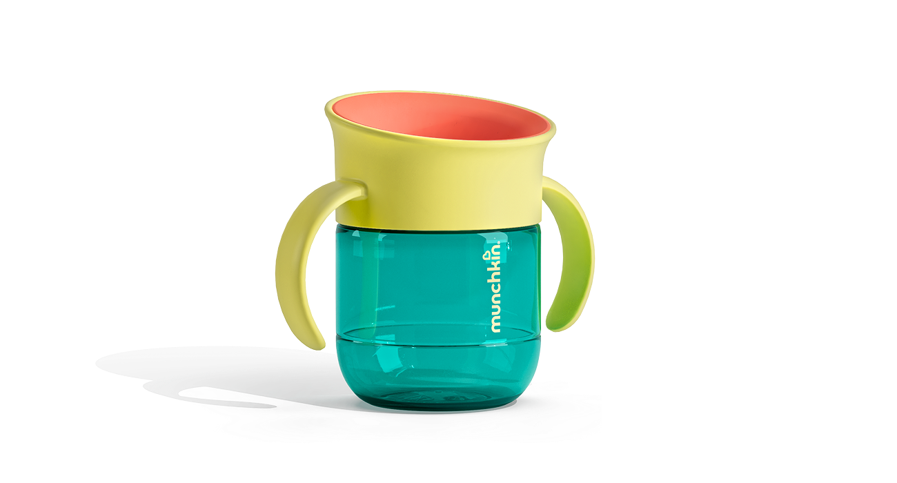 Munchkin two-piece training cup with yellow handles and rim, coral interior, and turquoise lower chamber