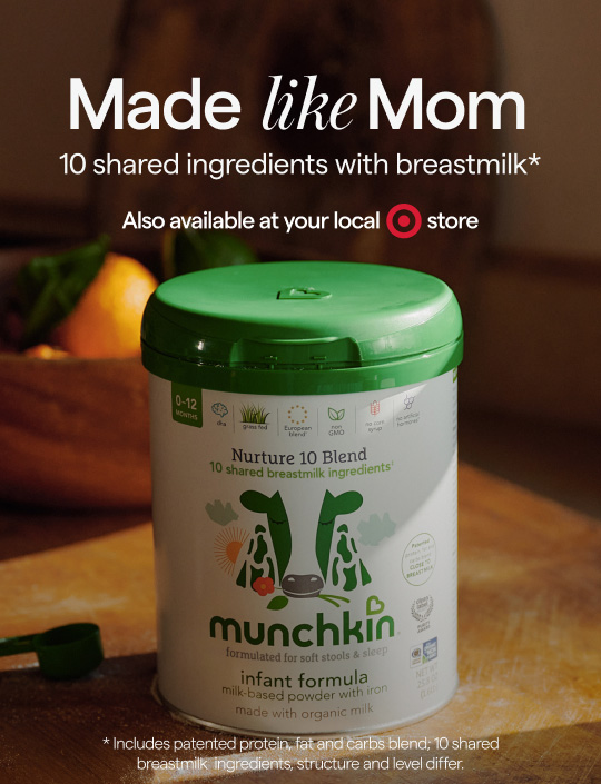 Munchkin Infant Formula can on wooden surface, with text "Made like Mom, 10 shared ingredients with breastmilk* Also available at your local Target store. *Includes patented protein, fat and carbs blend; 10 shared breastmilk ingredients, structure and level differ."